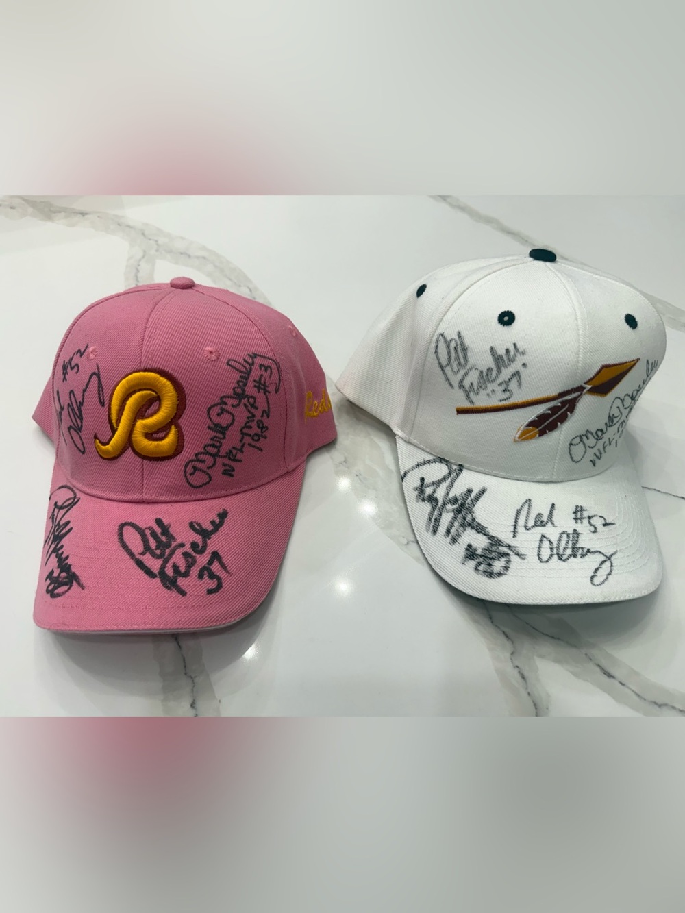 Autographed Redskins baseball hats.